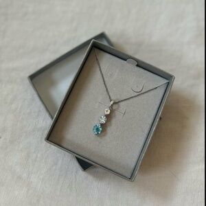 Zales Blue and White Topaz Three Stone Pendant in Sterling Silver